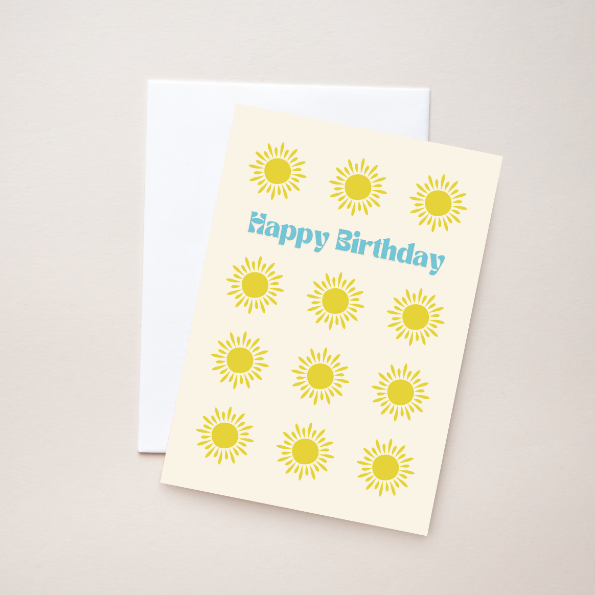 Greeting card with sun designs and 'Happy Birthday' text on a beige background.