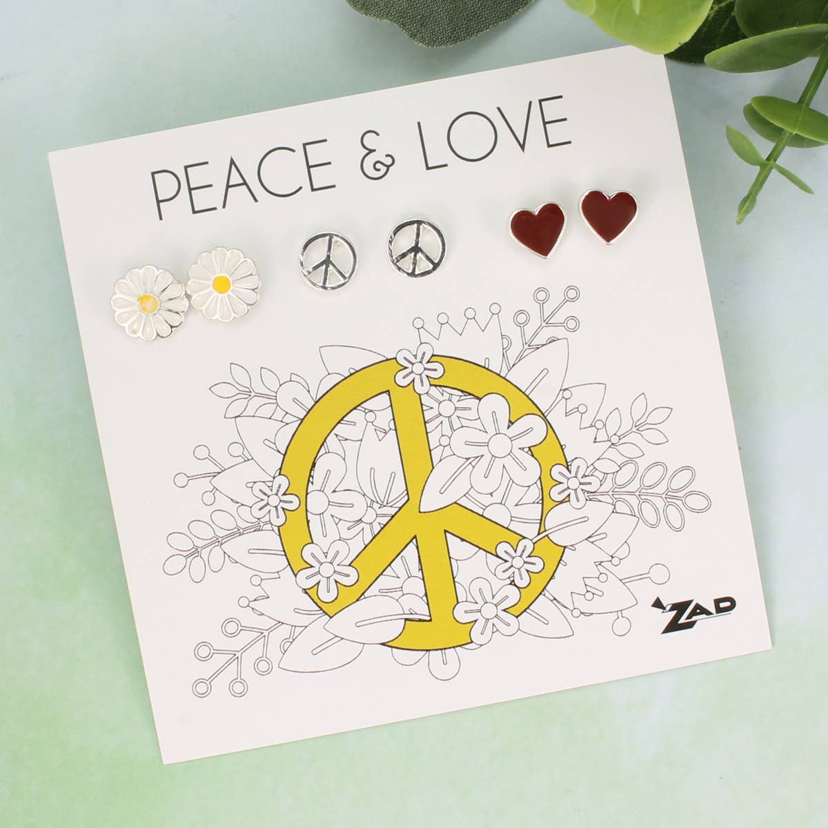 Card with peace symbol, flowers, and 'Peace & Love' text on a light green background.