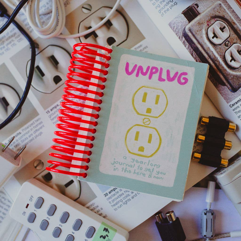 Card with 'UNPLUG' text surrounded by electrical cords and plugs on a white background.