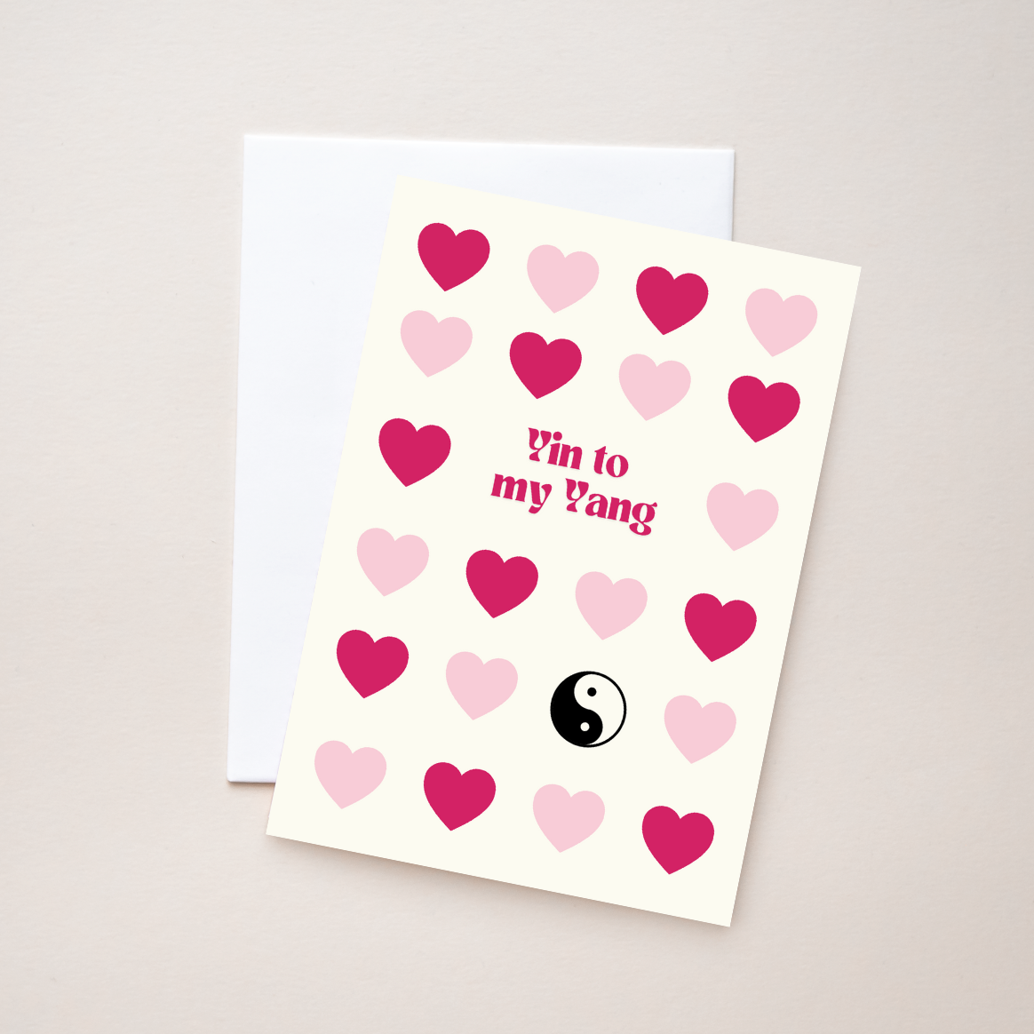 Greeting card with pink and red hearts and 'Yin to my Yang' text on a beige background.